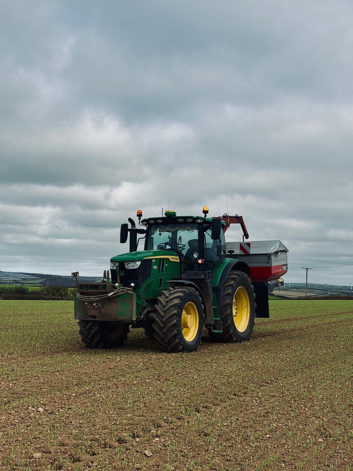 Tractor with fertiliser spreader