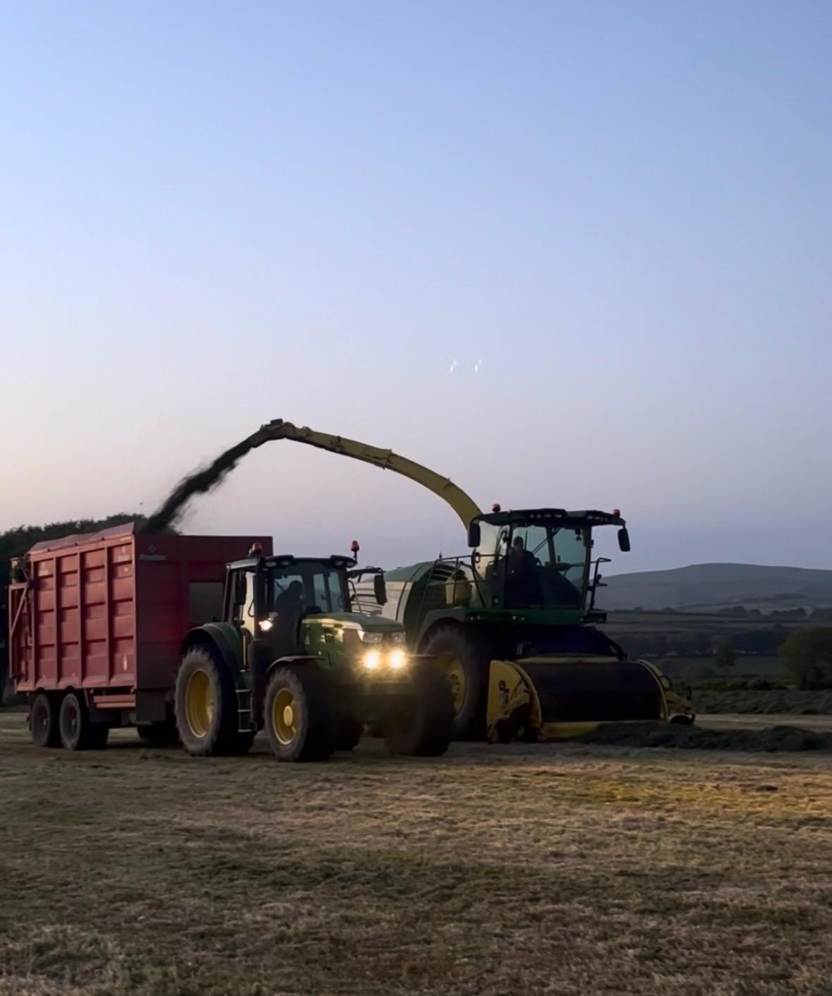 Forager loading silage wagon