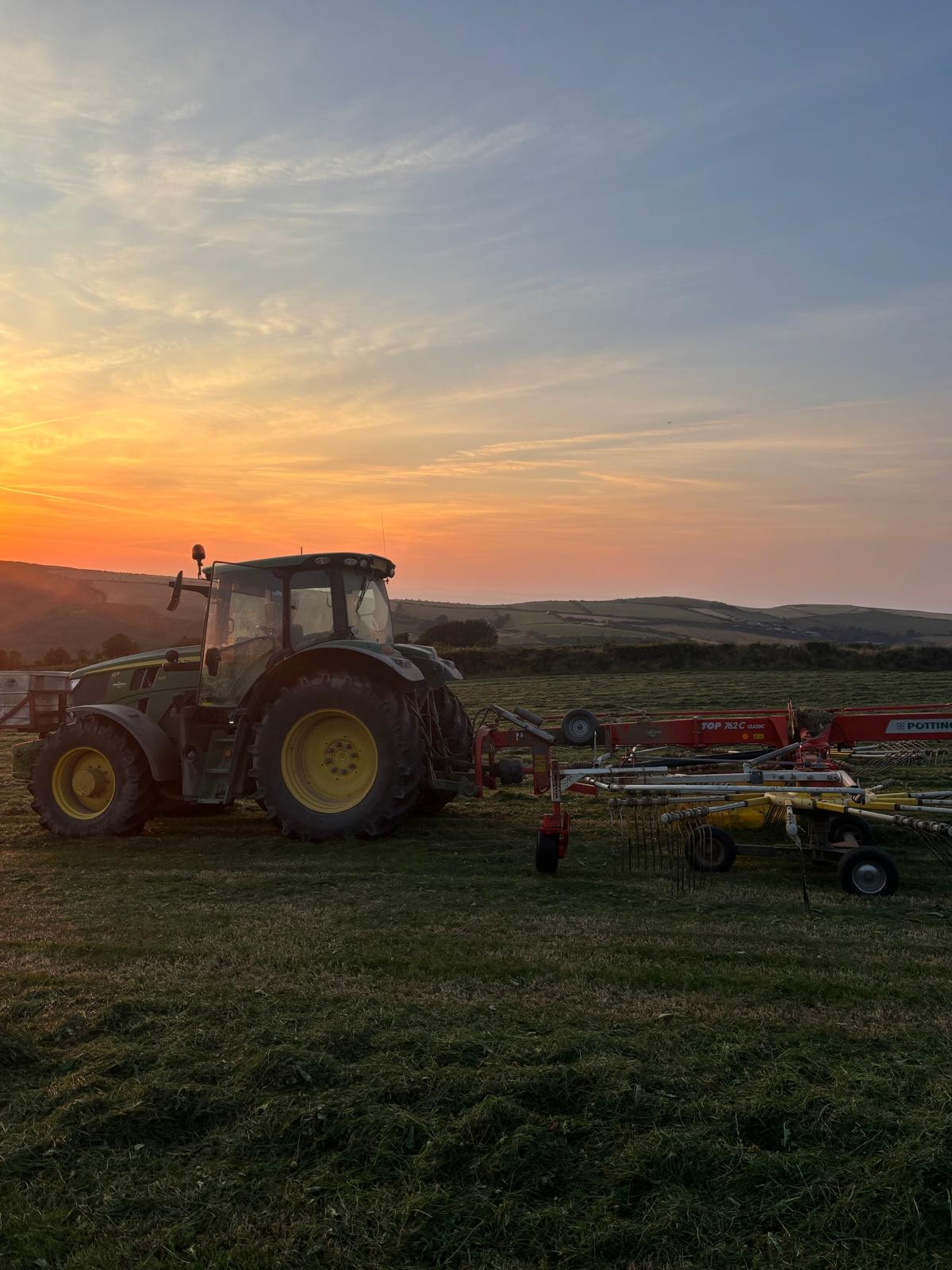 Tractor with baler — Devon hillside