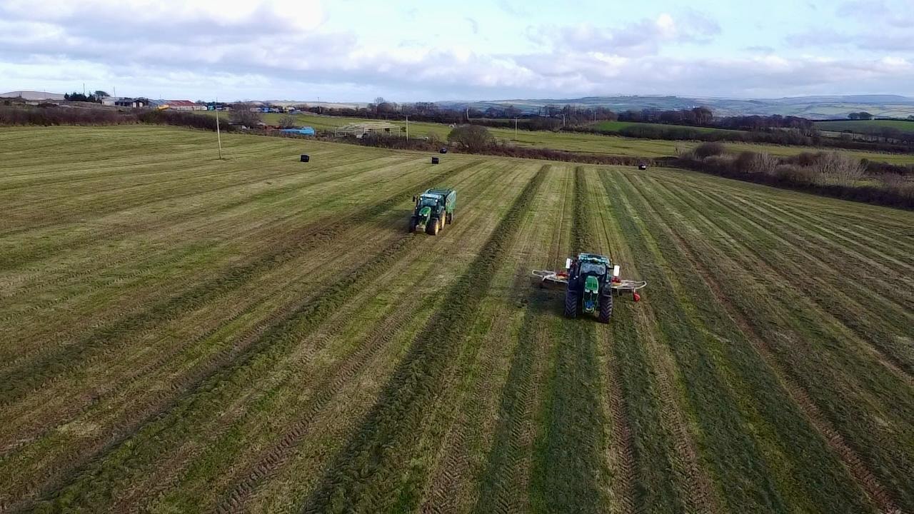 Two tractors mowing — aerial