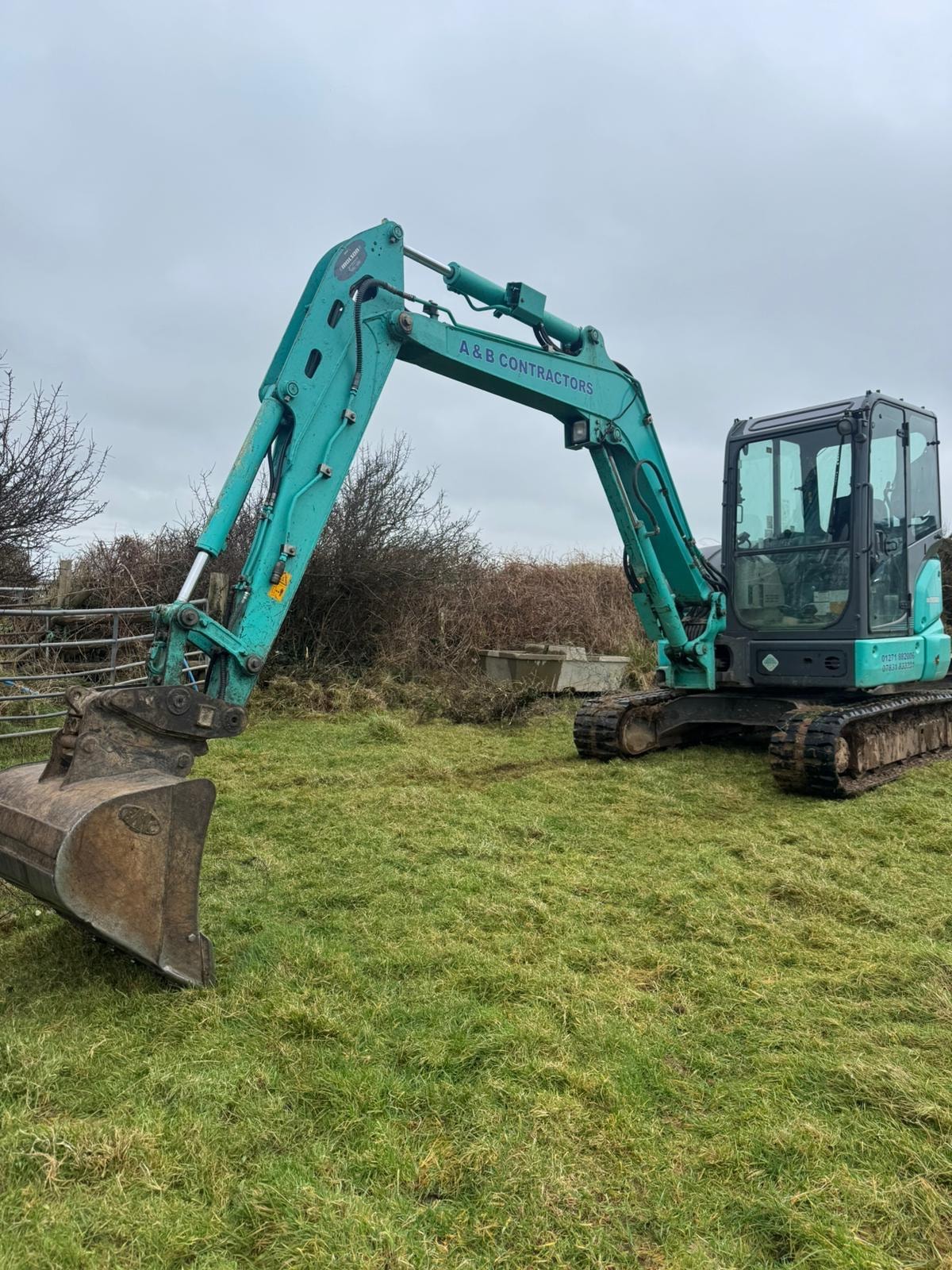 A&B Contractors mini digger — site work