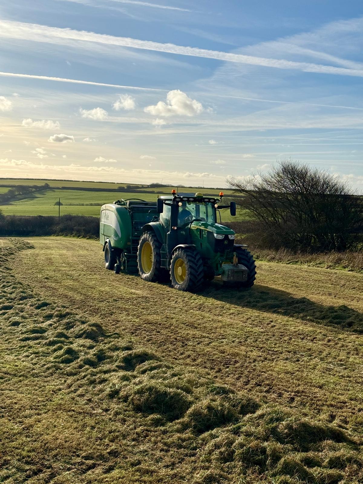 AMB Contractors tractor mowing Devon hillside